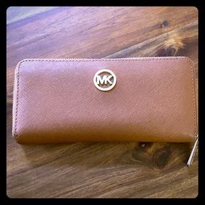 Michael Kors zip closure wallet.
